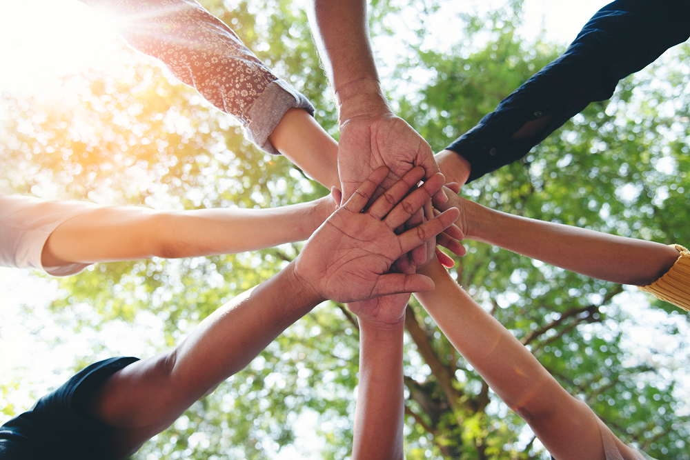 group with hands stacked